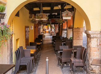 characteristic arcades and restaurants in his toric centre of Verona city, Veneto region, northern Italy, September 9, 2021