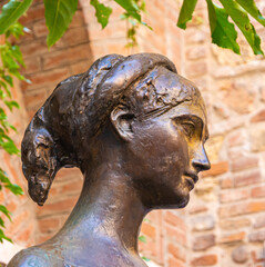 bronze statue of Juliet in the courtyard of House of Giulietta, historic centre of Verona...