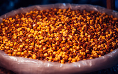 Large bag of dried peas at a night market in India. Popular food in india