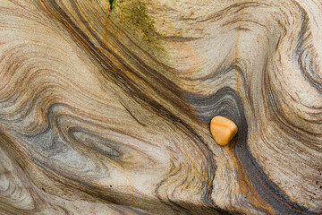 Colourful Pebble on Sandstone Geology at Spittal beach, Abstract Photograph, Northumberland stock photo