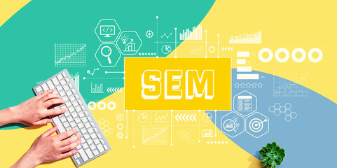 Fototapeta na wymiar SEM - Search Engine Marketing theme with person using a computer keyboard