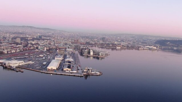 Aerial drone shot of central part of Oslo, Norway (Aker Brygge, Filipstad) at sunset