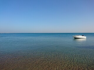 white boat by the sea