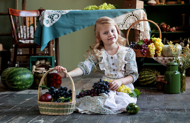 girl with long blond hair with a grape harvest in her hands