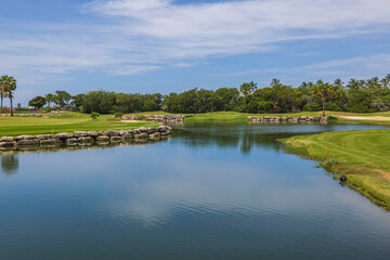 Beautiful view of lake and green golf courses on island of Aruba.