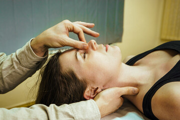 a woman at a CST treatment session, Osteopathic Manipulation and CranioSacral Therapy 7