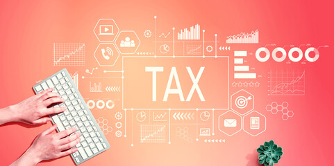 Tax theme with person using a computer keyboard