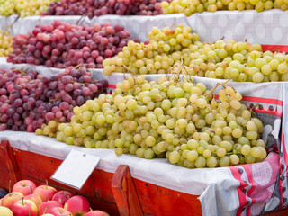 White and red grapes for sale on display at the market in Bucharest, Romania.