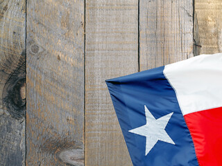 Texas State Flag on a wood background with copy space.