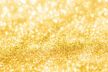 Gold glitter defocused texture background. gold christmas abstract background.