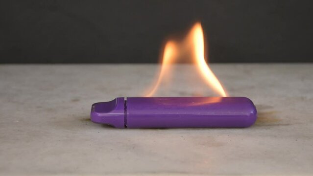 The electronic cigarette burns with a bright flame