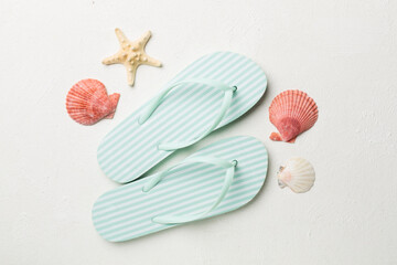 Striped flip flops on concrete background, top view