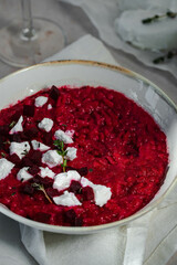 Homemade beetroot risotto with goat cheese and thyme 
