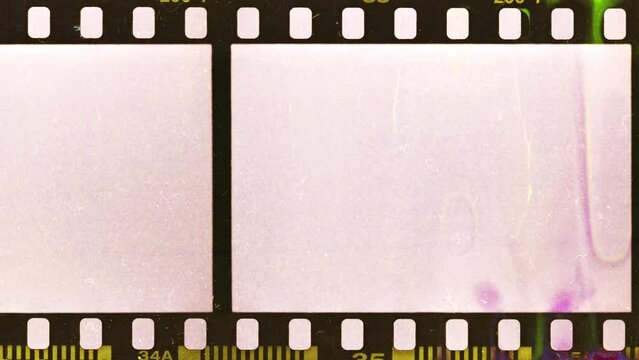 blank 35mm filmstrip with developing smear marks, scratches, dust and empty frames. cool video transition or overlay in 4k with luma mask.