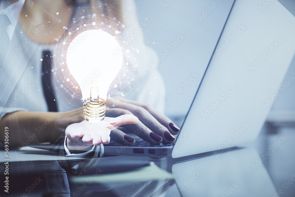 Poster double exposure of woman hands typing on computer and light bulb drawing. idea concept.