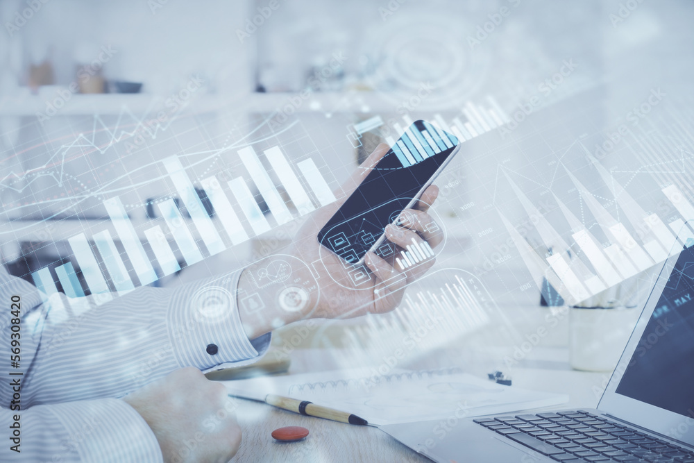 Poster double exposure of man's hands holding and using a digital device and forex graph drawing. financial