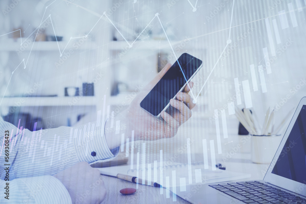 Aufkleber double exposure of man's hands holding and using a digital device and forex graph drawing. financial