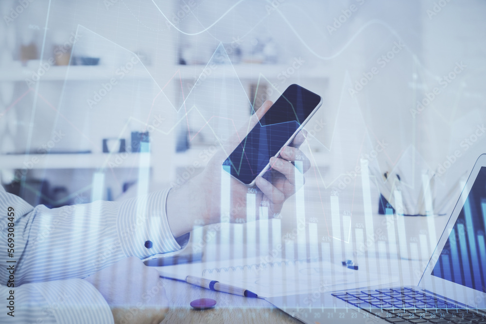 Poster double exposure of man's hands holding and using a digital device and forex graph drawing. financial