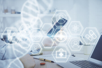Double exposure of man's hands holding and using a phone and DNA drawing. Medical education concept.