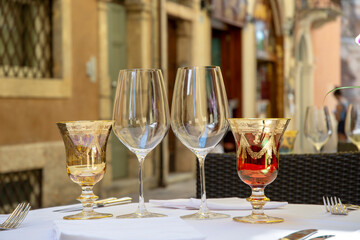 Empty elegant wine glasses set on a table in restaurant