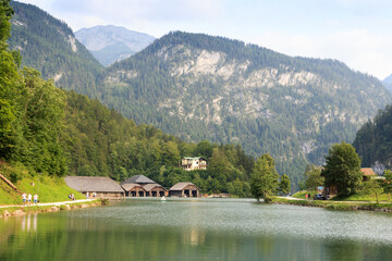 Fototapeta na wymiar Panorama view of lake Königssee with mountains and boathouses in Berchtesgaden, Germany