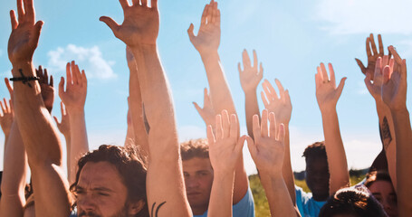 The dedicated volunteers concerned about the global problem of pollution. The joyful multiracial activists, conservationists raising their hands to the sky. Save our planet. Ecological problems.