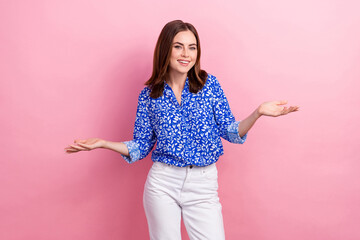 Photo of sweet funny woman dressed blue blouse comparing arms empty space isolated pink color background