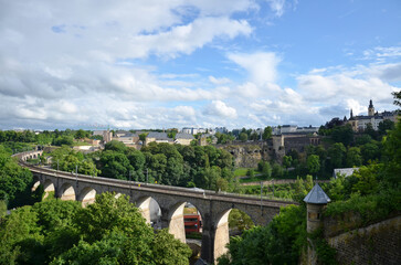 Fototapeta na wymiar Railway viaduct in Luxembourg with the city in the background - Viaduc de Pfaffenthal 
