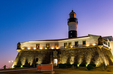 Sunset at the Barra lighthouse, one of the main tourist attractions in the city of Salvador, Bahia