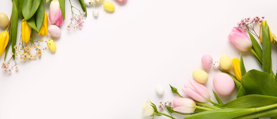 Beautiful flowers and Easter eggs on light background with space for text
