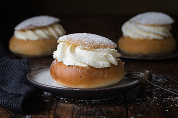 Semlor Swedish traditional cream bun with cardamom and almond paste