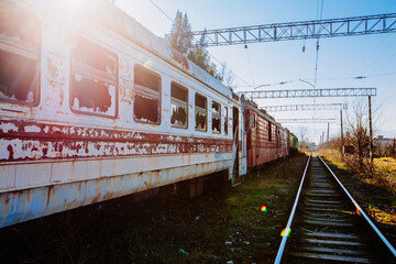 Old abandoned broken high speed train on railway