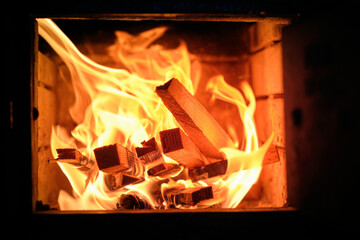 Logs and ashes inside a wood-burning fireplace