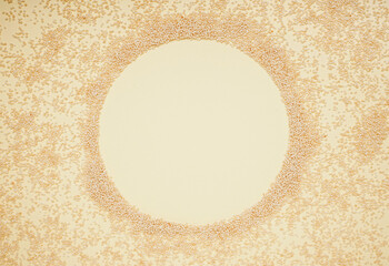 Frame made of amaranth seeds on color background