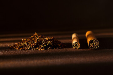 Cigarette. Cigarette, cigarillos and tobacco leaves close-up. Selective focus. Bad habits