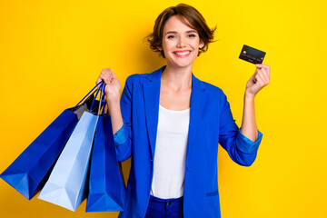 Fototapeta na wymiar Photo of positive agent business lady hold bags credit card enjoying fashion week weekend isolated bright color background