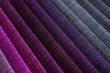 Fototapeta na wymiar Close up to a violet and grey tones of a upholstery cloth sample 