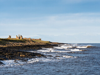 Dunstanburgh Castle on the Northumberland coast with copy space