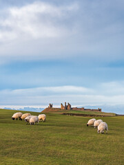 Obraz premium Dunstanburgh Castle on the Northumberland coast with copy space