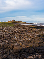 Dunstanburgh Castle on the Northumberland coast with copy space