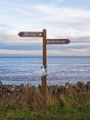 England Coast Path signpost in Northumberland, UK