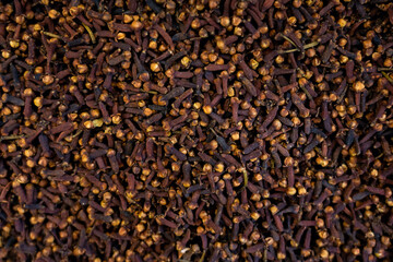  Dry spice cloves textured background, top view, close up. High quality photo
