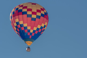 Hot Air Balloon in flight. Hot air ballooning flying in the sky in Switzerland.