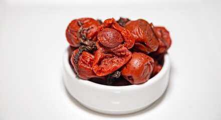 Japanese umeboshi, traditional kind of fermented salted plum with red shiso leaves.