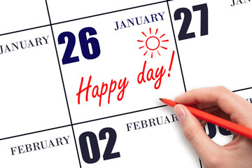 Hand writing the text HAPPY DAY and drawing the sun on the calendar date January 26
