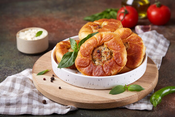 Peremech or belyash pies from yeast dough with grounded meat.  Street food. Savory snack. Delicious...