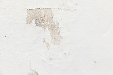 pattern of grunge wall with peeling white paint