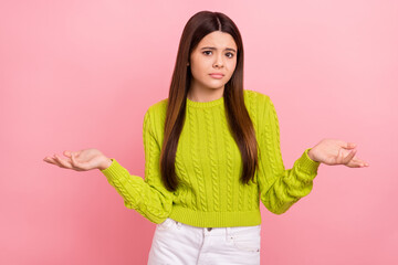 Photo portrait of pretty young schoolgirl shrug shoulders confused dont care dressed stylish green...