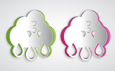 Paper cut Acid rain and radioactive cloud icon isolated on grey background. Effects of toxic air pollution on the environment. Paper art style. Vector