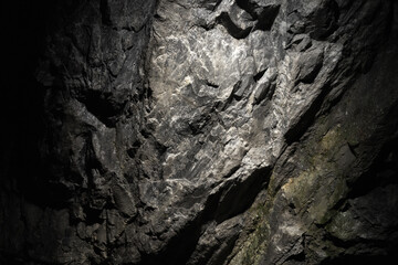 Cave wall of natural rough gray marble. Abstract background texture